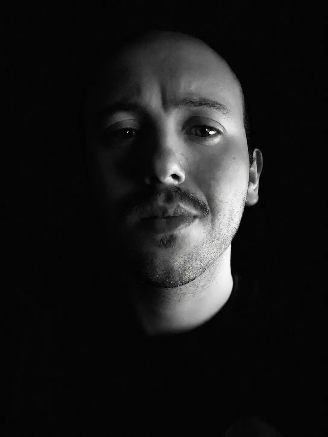 Black-and-white portrait of Emmanuel Caia.